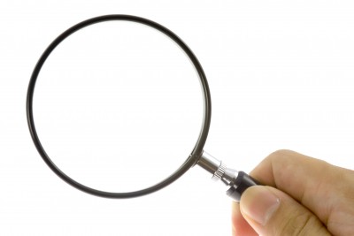 Magnifying glass with hand